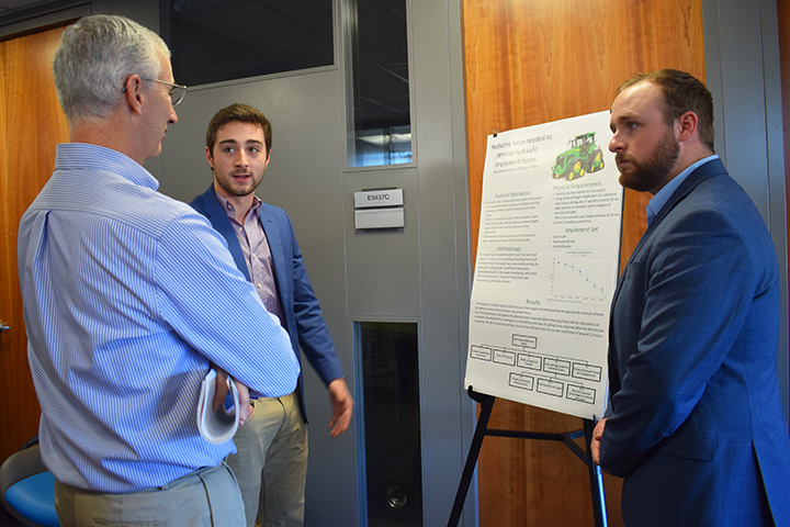 Jim Noble talks with students